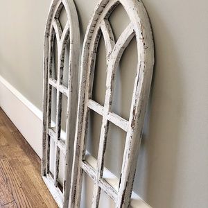 Two white architectural arch windows